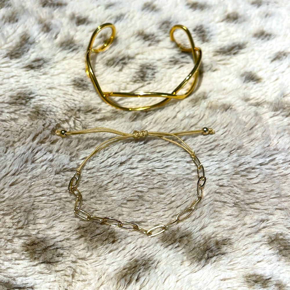 Two adjustable gold bracelets